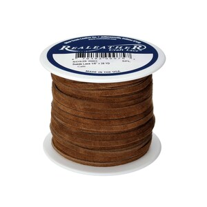 May include: A spool of brown suede leather lace, 1/8 inch wide, with a white label that reads "REALEATHER Craft Lace" and "Suede Lace 1/8" x 26 YD" and "MADE IN THE USA".