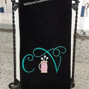 May include: Black golf towel with a green embroidered cursive letter "C" and a golf bag with clubs. The text "IdleTymeCreations.etsy.com" is printed on the towel.