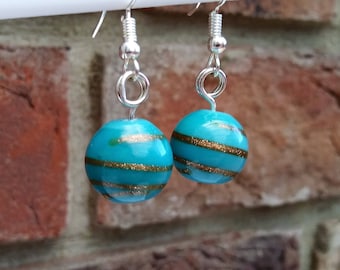 Glass bead earrings, blue gold swirl