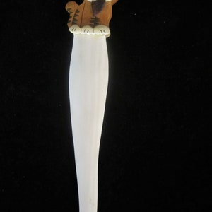 Letter Opener, Wood with Cat Motif. Clear light wood with straight grain, replica of a cat appears to be sitting on top of opening section!