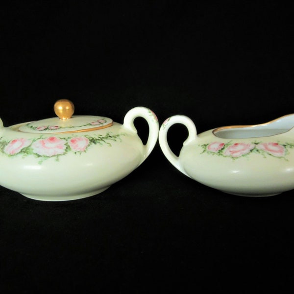 SILESIA Porcelain Creamer and Sugar Bowl-These gorgeous pieces are hand painted with lovely pink/white roses among green garlands. Art Deco