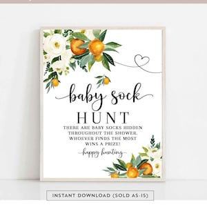 May include: Printable sign for a baby shower with a white background and orange and green floral design. The text reads "baby sock hunt" and "There are baby socks hidden throughout the shower. Whoever finds the most wins a prize! Happy hunting."