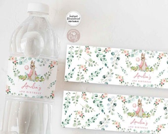 May include: Printable water bottle label featuring a watercolor illustration of a bunny rabbit with a pink dress and a pink balloon. The label has a white background with green leaves and pink flowers. The text on the label reads "Amelia's 2nd Birthday".