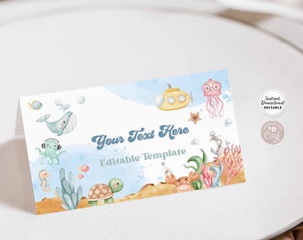May include: Editable template for a place card with a watercolor background featuring a submarine, jellyfish, octopus, turtle, and other sea creatures. The text "Your Text Here" is written in a retro font. The text "Editable Template" is written in a smaller font below the first line of text.