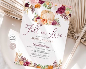 May include: Fall in Love bridal shower invitation featuring a watercolour design with pumpkins, flowers, and leaves in shades of pink, orange, and burgundy. The text "Fall in Love" is written in a cursive font. The invitation includes the date, time, and location of the shower.