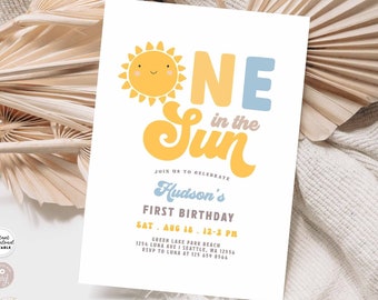 May include: A printable invitation for a first birthday party featuring a sun and the text "One in the Sun". The invitation is decorated with yellow, blue, and orange colours. The text on the invitation reads "Join us to celebrate Hudson's First Birthday, Sat. Aug 18, 12-3 PM, Green Lake Park Beach, 1254 Luna Ave I Seattle, WA 12556, RSVP to Luna at 125 659 8566".