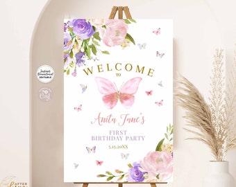 May include: A printable welcome sign for a first birthday party with a pink butterfly, purple and pink flowers, and the text "Welcome to Anita Jane's First Birthday Party 5.15.20XX".