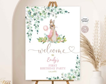 May include: Printable welcome sign for a first birthday party with a watercolor illustration of a bunny rabbit holding a pink balloon. The sign has a green leafy border and the text "Welcome to Emily's First Birthday Party 5.15.20XX".