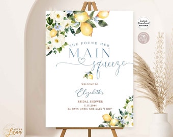 May include: A printable bridal shower sign with a lemon and floral design. The sign says "She found her main squeeze" and "Welcome to Elizabeth's Bridal Shower 5.15.2046 56 days until she says "I do!"
