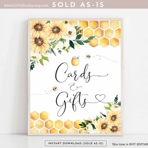 May include: A printable sign with a white background, featuring a honey pot, bees, sunflowers, and honeycomb. The text on the sign reads "Cards & Gifts".