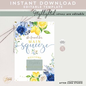May include: A printable bridal shower sign with a watercolor design of lemons, blue flowers, and white flowers. The text on the sign reads "She found her main squeeze" and "Welcome to Elizabeth's Bridal Shower".