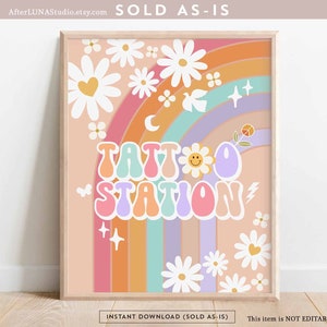 May include: A digital printable featuring a rainbow with a peace sign, a crescent moon, and stars. The text "TATTOO STATION" is in a retro font with a smiley face and a lightning bolt. The background is peach with white daisies.