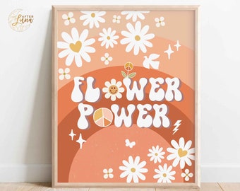 May include: A digital print with a peach background featuring a rainbow arch with the text "FLOWER POWER" in a retro font. The text is surrounded by white daisies with yellow centers and peace signs. The print has a vintage 70s aesthetic.