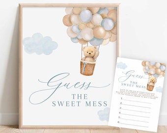 May include: A printable baby shower game card with a blue and beige colour scheme. The card features a teddy bear in a hot air balloon made of balloons. The text on the card reads "Guess the Sweet Mess".