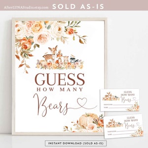 May include: A printable baby shower game with a woodland theme. The game asks guests to guess how many bears are in the image. The image features a deer, fox, raccoon, and other woodland animals. The text "Guess How Many Bears" is written in brown text with a heart symbol. The game includes two printable cards for guests to write their guesses.