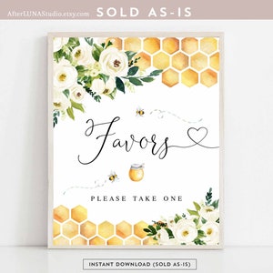 May include: A printable sign with white flowers and a honeycomb pattern. The sign says "Favors" and "Please take one".