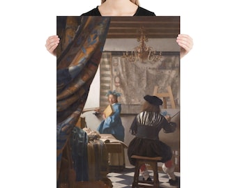 May include: A painting depicting a scene inside an artist's studio. A man in a black and white striped shirt sits on a stool and paints a canvas. A woman in a blue dress stands in the background, holding a book. The studio is decorated with a large tapestry and a chandelier.