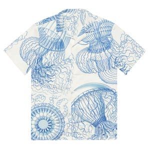 May include: A white short-sleeved button-down shirt with a blue and white jellyfish print.
