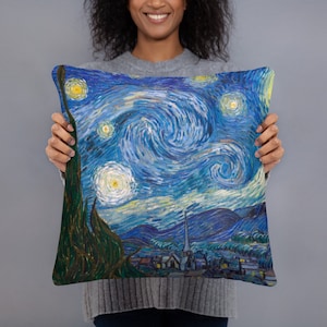 May include: A throw pillow with a blue and yellow print of Vincent van Gogh's "Starry Night" painting.