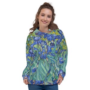 May include: A blue and green hoodie with a print of a painting of iris flowers. The hoodie has a drawstring hood and a kangaroo pocket.
