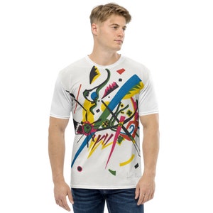 May include: White t-shirt featuring a colourful abstract design with geometric shapes, lines, and a signature. The design is reminiscent of the style of artist, Kandinsky.