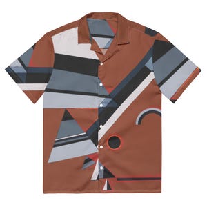 May include: Short-sleeved shirt with an abstract geometric design. The shirt has a brown base colour and a pattern of black, white, grey, and red shapes. The collar and button placket are visible.