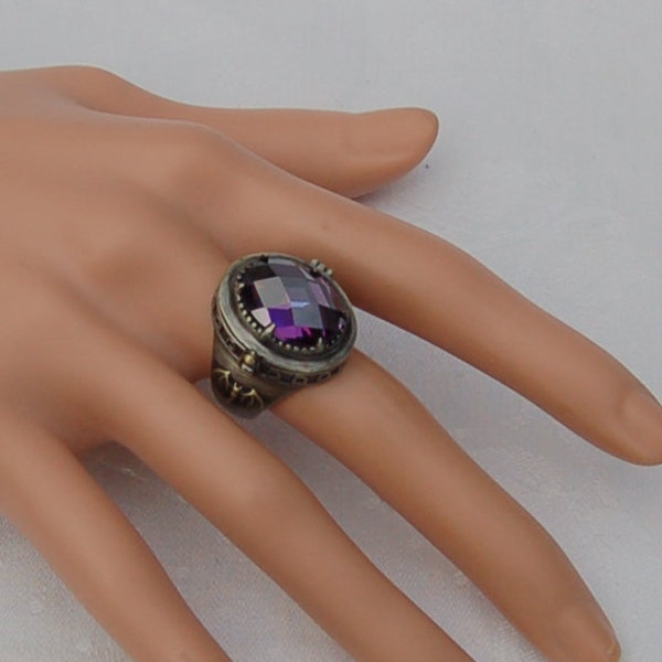 Poison ring with secret compartment. Stunning . Massive Gothic design with a fine cut Amethyst gem. Large and Heavy. Most impressive.