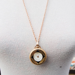 Fine Swiss Vintage Pocket Watch Pendant on long gold coloured Chain.