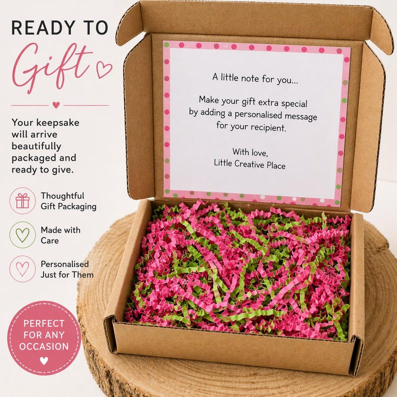 May include: A brown cardboard gift box, open to reveal pink and green shredded paper. A note inside says, "A little note for you..." and "Make your gift extra special by adding a personalised message."