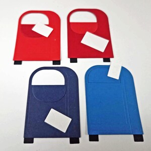 May include: Four colorful mailbox cutouts in red, blue, and navy blue. Each mailbox has a white slot and a small white rectangle, resembling a letter, is placed in the slot. The mailboxes have black feet and a curved top.