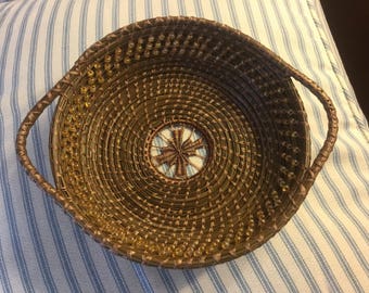 Pine Needle Basket with handles, teneriffe center, amber glass beads, stitched with brown artificial sinew.  Handmade, OOAK.