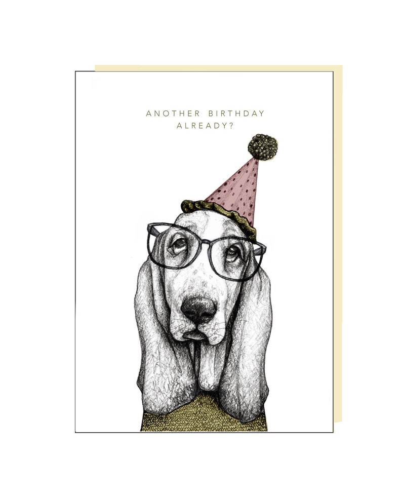 May include: A black and white illustration of a basset hound wearing a pink party hat with a black pom-pom and black framed glasses. The text "Another birthday already?" is above the dog.