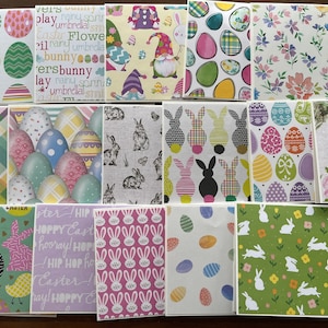 May include: A set of 14 colorful Easter-themed coasters featuring various designs, including bunnies, eggs, gnomes, and floral patterns. The coasters are made of a durable material and are perfect for adding a festive touch to your home decor.