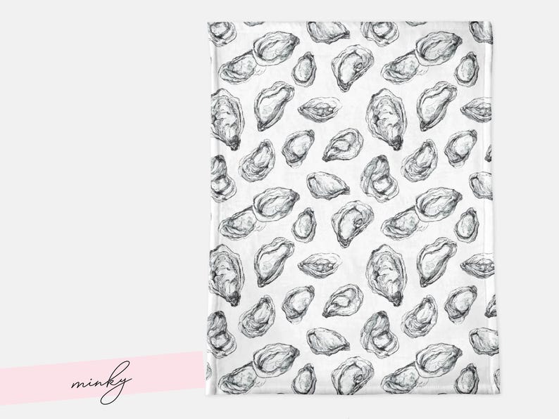 May include: A white blanket featuring a repeating pattern of grayscale oyster illustrations. The oysters are depicted in detail, in various sizes and orientations. The word "minky" is written in cursive on a pink banner.