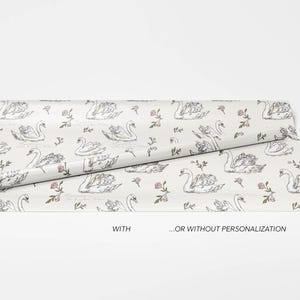 Swan wrapping paper roll displayed with and without personalization on a clean white background showing customizable wedding gift wrap design options