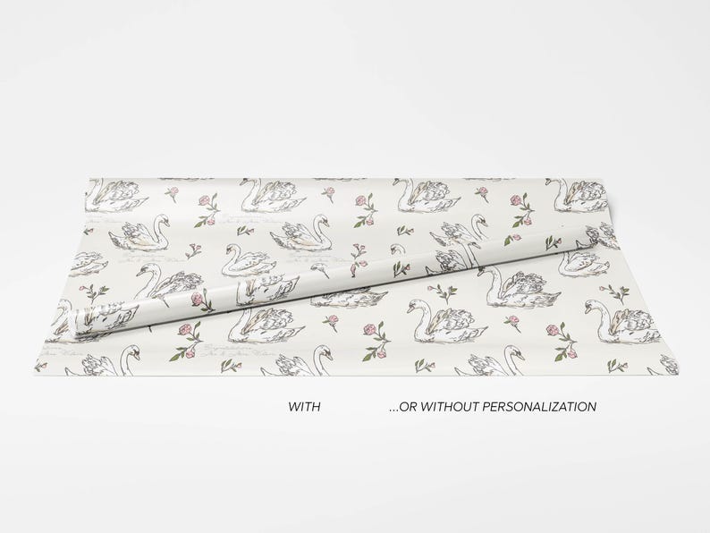 Swan wrapping paper roll displayed with and without personalization on a clean white background showing customizable wedding gift wrap design options