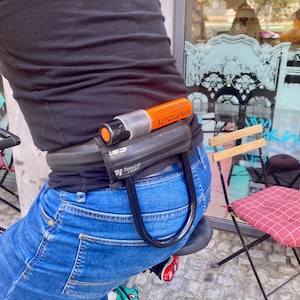 Cyclist&#39;s utility belt with optional U lock holster made from recycled bicycle tire