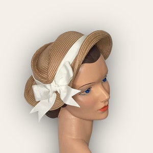 Eva straw hat, bronze color, with white bow and matching hat pin, 1950s, reproduction