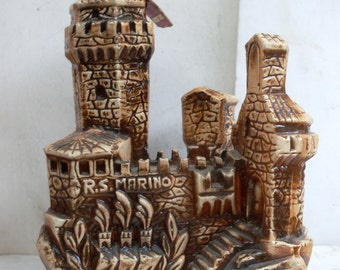 bottle decanter vintage, souvenir San Marino Italy, bottle contains almond amaretto, bottle-shaped castle San Marino