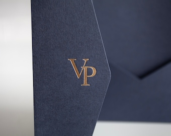 May include: A dark blue envelope with a gold foil embossed "VP" monogram.