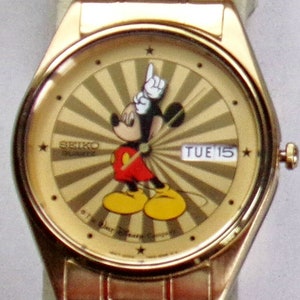 Brand-new Seiko Men’s Mickey Mouse Watch! Starburst Dial day/date!