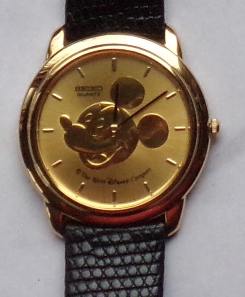 mickey embossed leather and canvas trainer