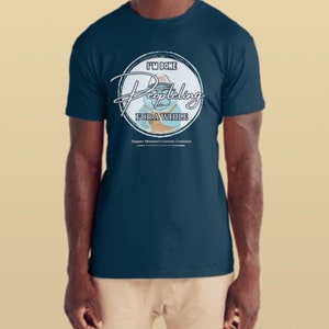 May include: A navy blue t-shirt with a white circle graphic featuring a cartoon character wearing a hat and the text "I'm done peopling for a while".