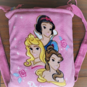 Disney Princesses Fleece Throw. Snow White Belle Blanket with Attached Backpack. Blanket for Day Car. Folds into Backpack for Easy Carry