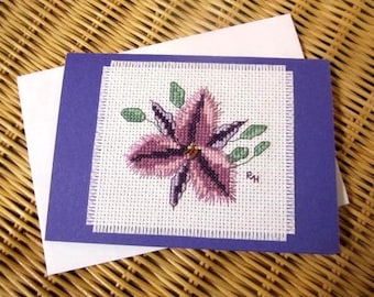 Hand cross stitched Australian native flora card - Fringe Lily.  Purple card with white envelope and white paper insert.