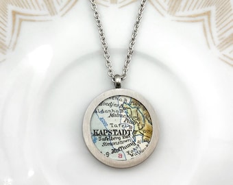 Medallion of your favorite city with vintage maps. Personalized