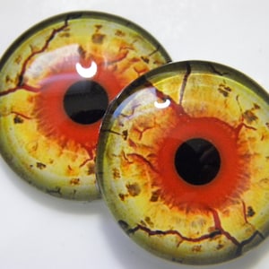 Glass eyes, monster eyes, yellow monster eyes, zombie eyes, yellow zombie eyes, cabochon eyes, creature eyes.  Choose size from menu.