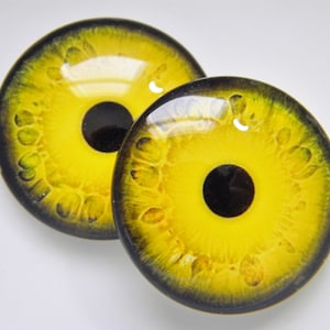 Glass eyes, monster eyes, yellow monster eyes, zombie eyes, yellow zombie eyes, cabochon eyes, creature eyes.  Choose size from menu.