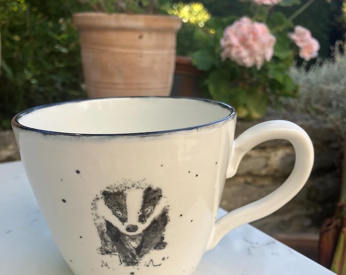 Handmade hand painted white ceramic tea or coffee cup with hand painted badger design free U.K. delivery