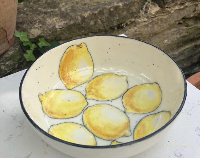 Lovely handmade pottery ceramic cream coloured bowl with hand painted lemons design for food or decorative item. Medium sized.